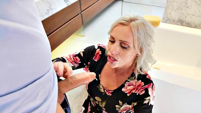 A kinky MILF with gloves get her ass drilled in the bathroom