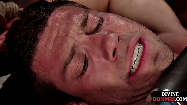 Dominant babe straponing tied man