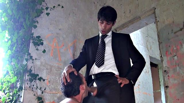 Tattooed guy doggystyled by suited man after throating