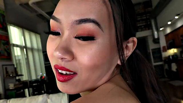 Asian babe jerks POV cock while talking dirty