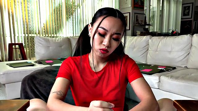 Asian babe jerks POV cock while talking dirty