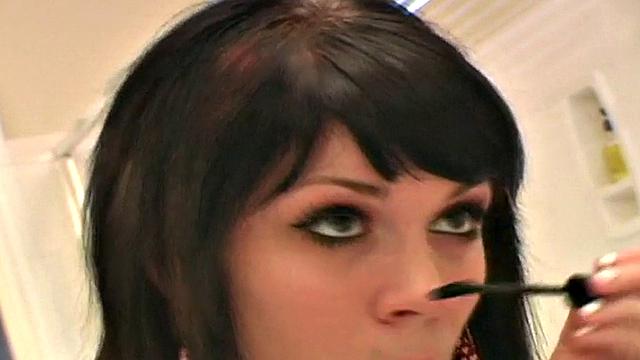 Pretty teen does her makeup