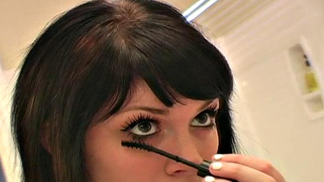 Pretty teen does her makeup