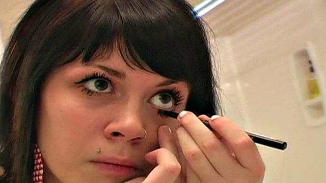 Pretty teen does her makeup