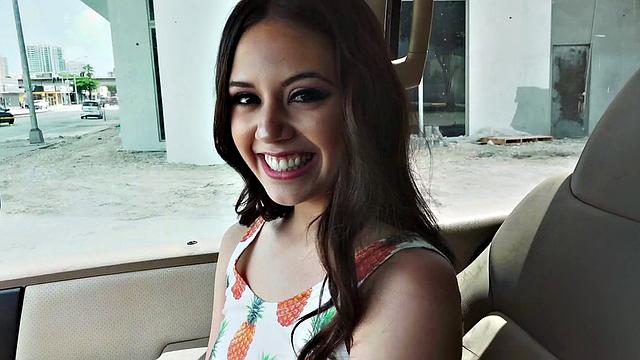 A cute brunette teen grind on a hard cock in a car