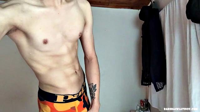 We find this Latin boy stripped to his underwear and smearing oil all over his skinny and smooth body. By the time he pushes his underwear down, Paul has a big stiff cock in hand and starts stroking.