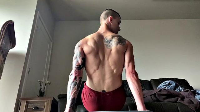 Ripped jock masturbates and plays with big dildo solo