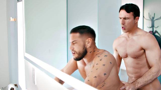 Muscled tattoo guys barebacking in indoors duo