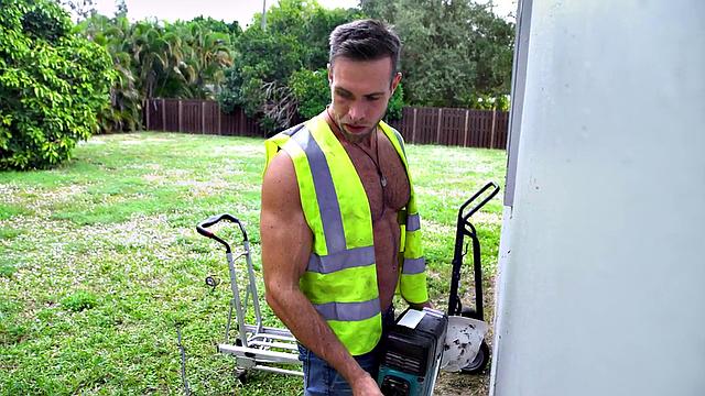 Watch this horny BWC hunk pound a nympho stud's ass in the living room