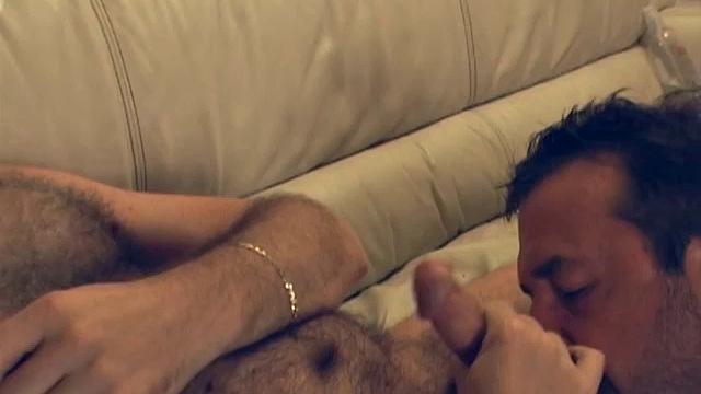 When Victor walks into the room, Rusty is already preparing his cock for Victor's hot mouth. Victor stands back a moment and then moves in to get a big wet taste of Rusty's fat cock and hairy chest.