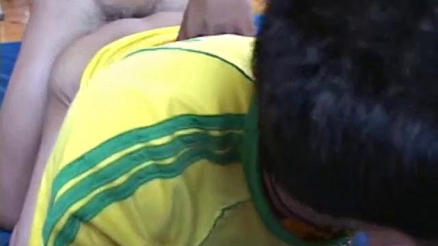 We look in on Asian boy Kob, busy licking and sucking Wut's cock and balls. Soon they are on the stairs where Kob continues to toy with Wut's stiff dick, until he fires his load onto Kob's red shirt.