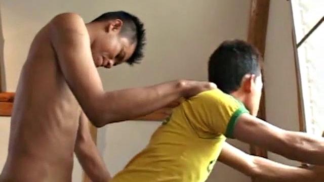 We look in on Asian boy Kob, busy licking and sucking Wut's cock and balls. Soon they are on the stairs where Kob continues to toy with Wut's stiff dick, until he fires his load onto Kob's red shirt.
