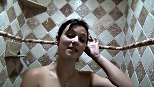 Showering solo teen masturbates under the water