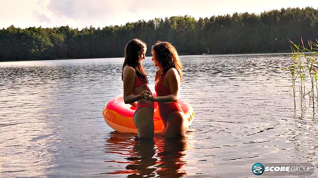 Margo Von Teese and Simona splash each other in bikinis before eating each other on the beach.