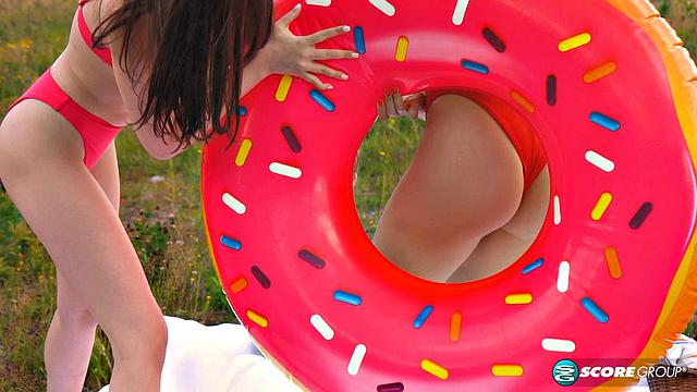 Margo Von Teese and Simona splash each other in bikinis before eating each other on the beach.