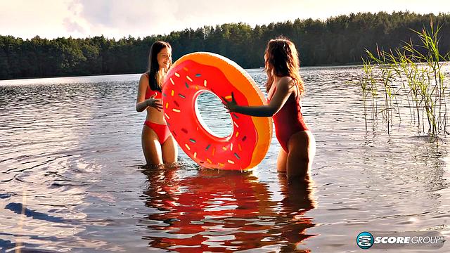 Margo Von Teese and Simona splash each other in bikinis before eating each other on the beach.