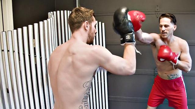 Boxing stud barebacked by tattooed top and sprayed with cum