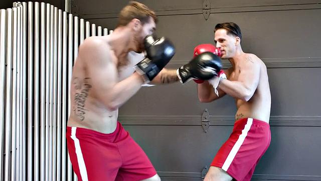 Boxing stud barebacked by tattooed top and sprayed with cum