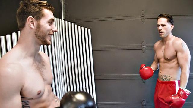 Boxing stud barebacked by tattooed top and sprayed with cum