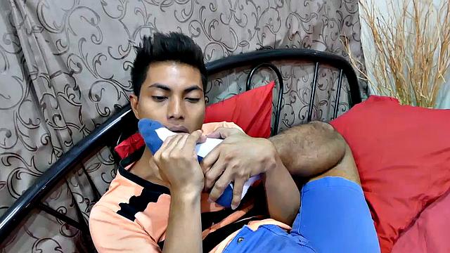 This horny looking Asian boy has about the hottest Asian feet you ever did see. Watch as Josh slides his shoes off and take in the sweet foot aroma by burying his face in his shoe. He begins to caress and lick his boy feet as he grows a boner.