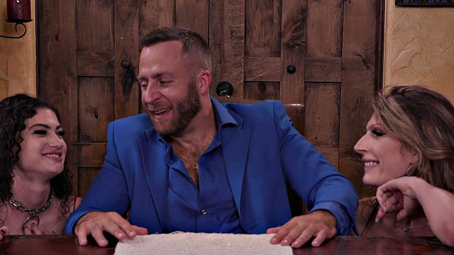 Brunette hottie with curly hair takes on two guys in a steamy threesome