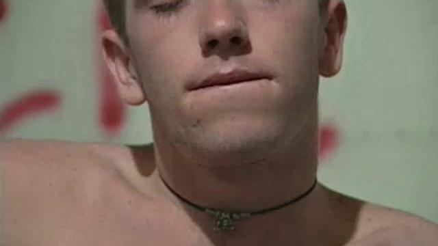 We look on as Corey Stevens sprays graffiti on a basement wall then strips naked to jack off