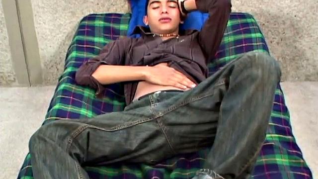 Brad is flat on his back, ready to beat his meat. Clothes start stripping off as skinny twink pulls out a big stiff cock from the leg of his underwear.