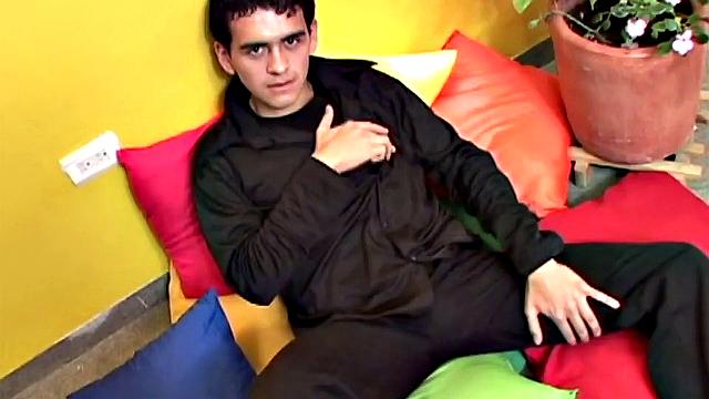 Skinny and smooth Damian kicks back on pillows, jerks off, stripped, with boner in hand