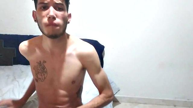 In his bedroom, this skinny Latin boy quickly strips out of his boxer briefs and works up a stiff one. He is all over the place, while showing us his little butt and beating off.