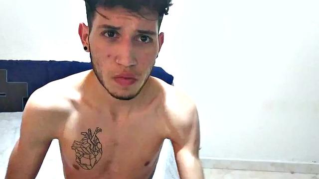 In his bedroom, this skinny Latin boy quickly strips out of his boxer briefs and works up a stiff one. He is all over the place, while showing us his little butt and beating off.