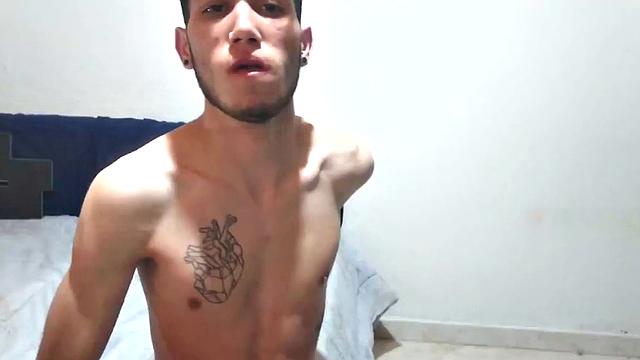 In his bedroom, this skinny Latin boy quickly strips out of his boxer briefs and works up a stiff one. He is all over the place, while showing us his little butt and beating off.