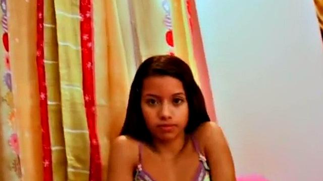 A kinky Colombian teen finger her pussy in socks and lingerie