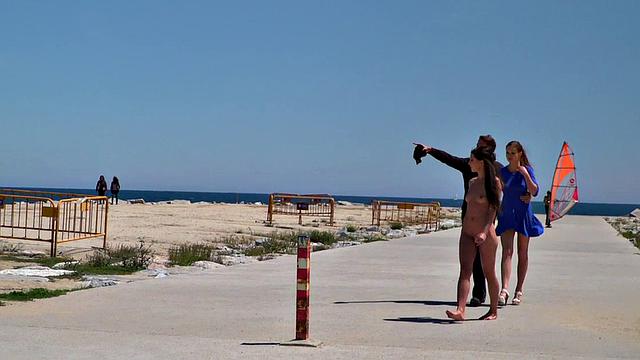 Public euro walks and crawls outdoors in front of strangers