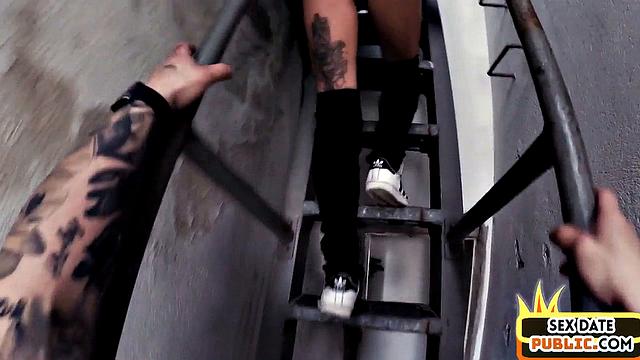 Public MILF with tattooed body fucked in building