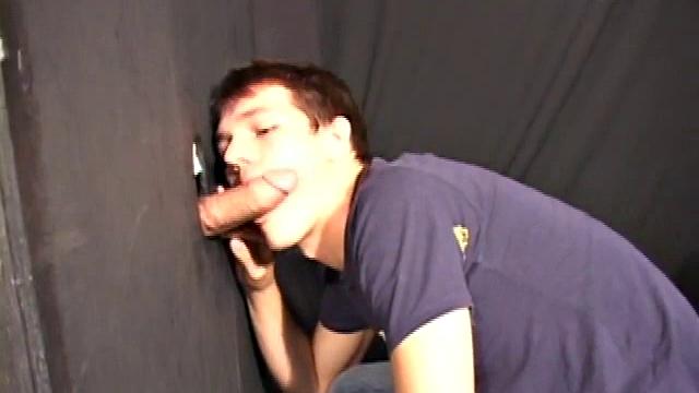 Sucking on a huge dick through a glory hole, 20 year old Nick shows his oral skills. The guy receiving the blow job loves it and in no time the stud strokes his cum load onto Nick's face.