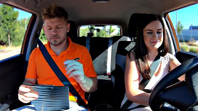 Inked babe pleasing instructor to pass driving test