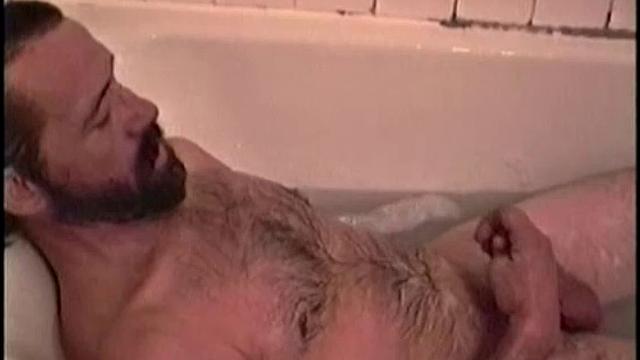 After staying the night and fucking me, I asked my friend Henry if I could film him in the bath tub shooting another load. He said sure, so here it is.