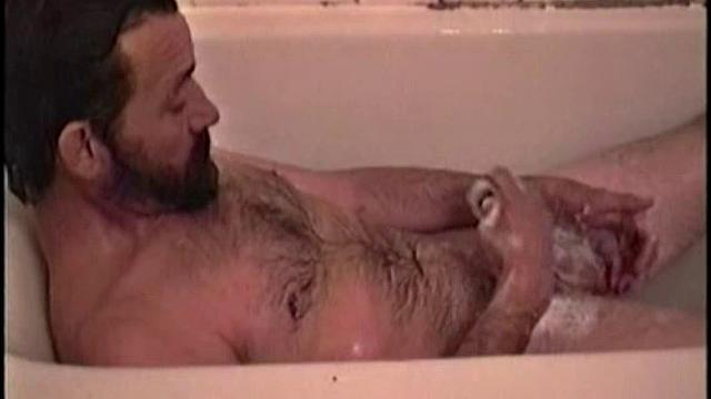 After staying the night and fucking me, I asked my friend Henry if I could film him in the bath tub shooting another load. He said sure, so here it is.