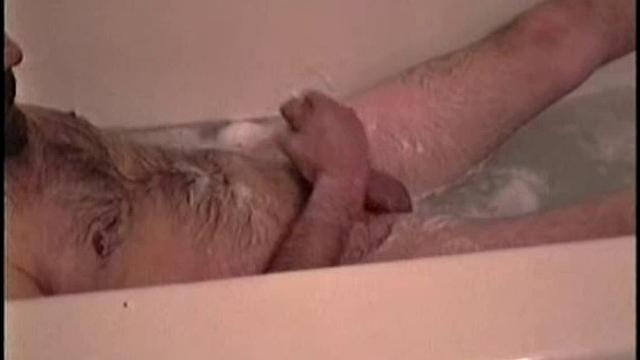 After staying the night and fucking me, I asked my friend Henry if I could film him in the bath tub shooting another load. He said sure, so here it is.