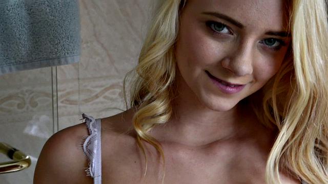 Young, skinny blonde Riley scrubs her tiny body in the shower.