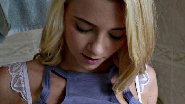 Young, skinny blonde Riley scrubs her tiny body in the shower.