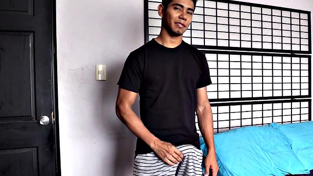 Latin boy Sebastian slowly strips to underwear, pulls out big stiff cock, plays, gets naked, beats off standing