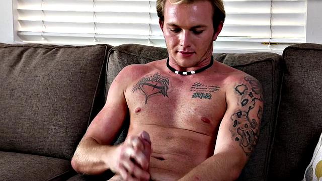 Watch this tattooed newcomer tugging his unshaved shaft in solo playtime