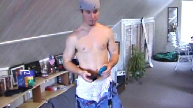 Cory Woodall watches a porn video near his skateboard. The camera takes us on a tour of Cory's body, which looks cuter than ever. When viewed from the floor up, this boy's balls are huge.