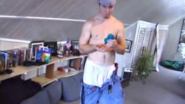 Cory Woodall watches a porn video near his skateboard. The camera takes us on a tour of Cory's body, which looks cuter than ever. When viewed from the floor up, this boy's balls are huge.