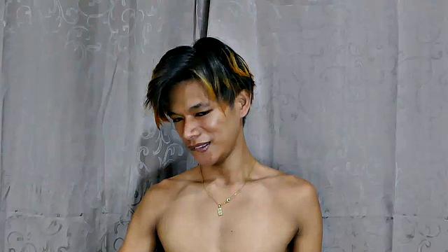 This sexy Asian gay foot fetish boy has beautiful slim male feet. He starts off posing his lovely boy feet then moves to the bed to tease you with them. He starts sucking his toes and rubbing his cock on his smooth soles.