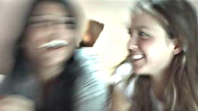 Sexy petite lesbians teasing the camera in close up