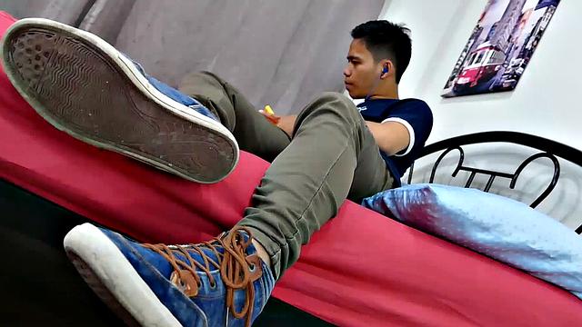 Asian twink Marcon's obsession with male feet keeps him thinking about his fetish most of the time. Marcon gives in and starts feeling.