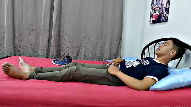 Asian twink Marcon's obsession with male feet keeps him thinking about his fetish most of the time. Marcon gives in and starts feeling.
