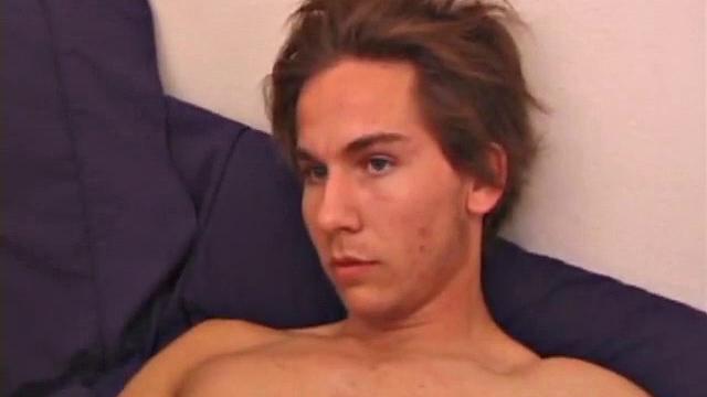 Sprawled out on the bed, Brock Labelli pulls out his cock and starts stroking. After the cameraman douses him with baby oil he continues to play with Brock's dick.